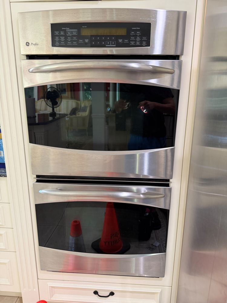 Lankon technician servicing a GE Profile double wall oven on Long Island NY