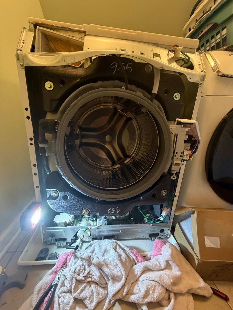 Lankon technician repairing a Samsung front-load washer in Queens NY